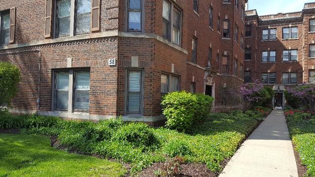 58 Forest Avenue, Unit G Riverside, IL 60546 - Photo 3 of 19 a view of a brick building next to a yard