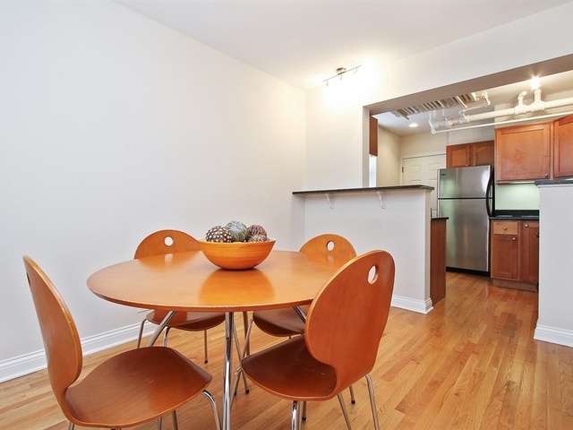 58 Forest Avenue, Unit G Riverside, IL 60546 - Photo 9 of 19 a view of a dining room with furniture and wooden floor