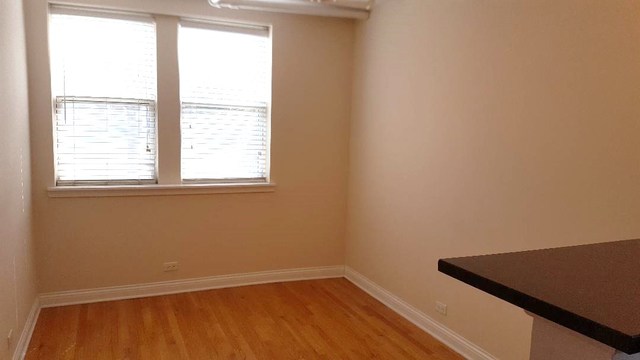 58 Forest Avenue, Unit G Riverside, IL 60546 - Photo 10 of 19 an empty room with a window