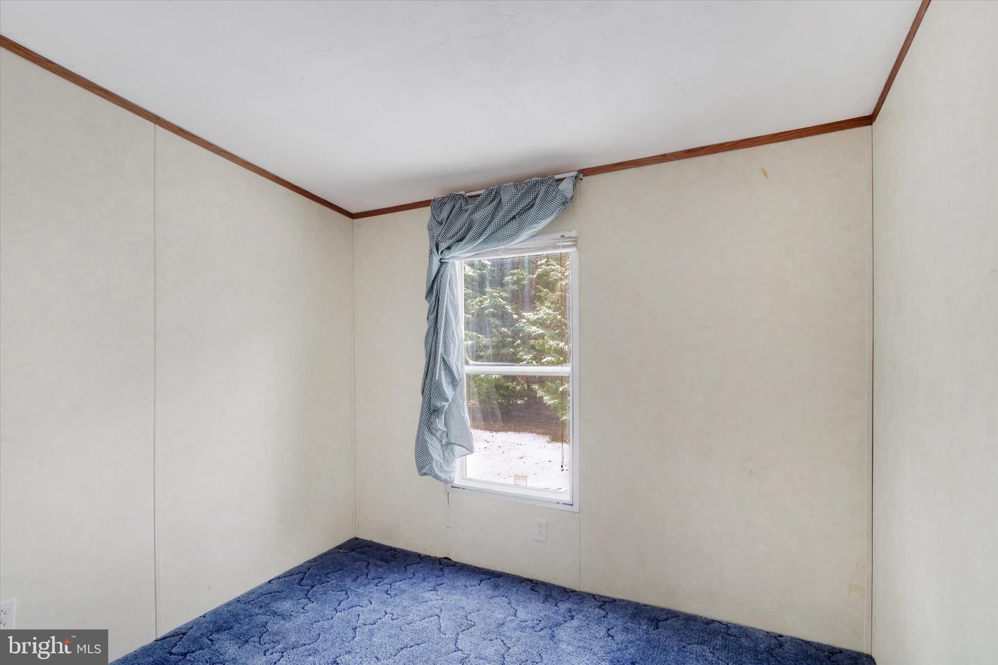 40 Stevens Road Etters, PA 17319 - Photo 11 of 19 a view of an empty room with wooden floor and a window