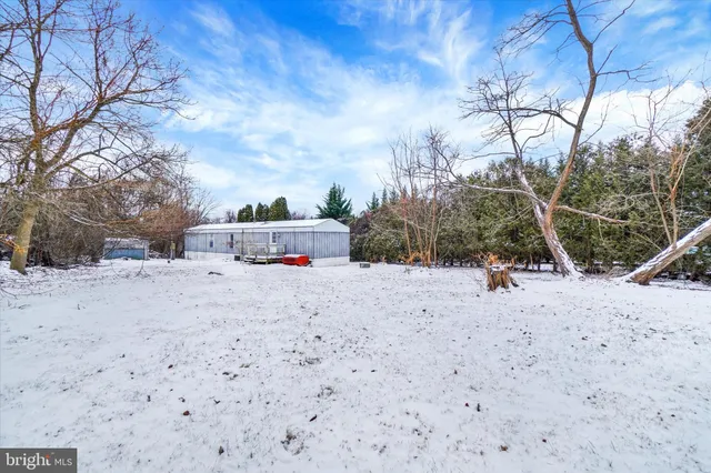 a view of backyard and snow