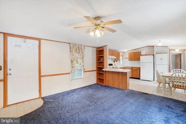 a kitchen with stainless steel appliances a refrigerator and a sink