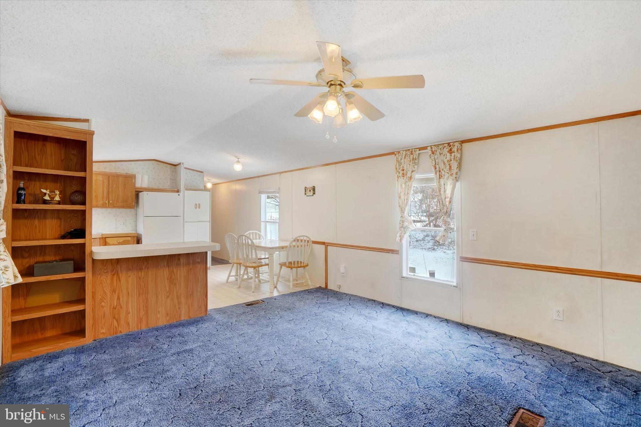 40 Stevens Road Etters, PA 17319 - Photo 5 of 19 a view of a kitchen with furniture and a ceiling fan