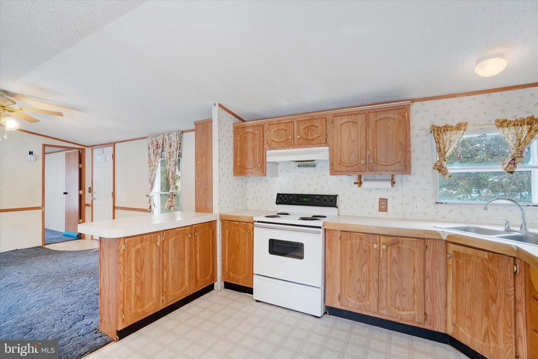 40 Stevens Road Etters, PA 17319 - Photo 7 of 19 a kitchen with granite countertop white cabinets and white appliances