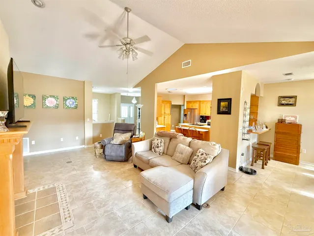 a kitchen with a refrigerator and a sink