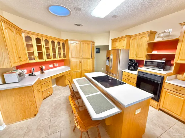 a living room with furniture a dining table and a wooden floor