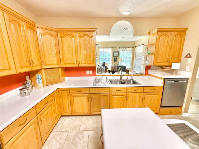 a bathroom with a sink mirror vanity and toilet