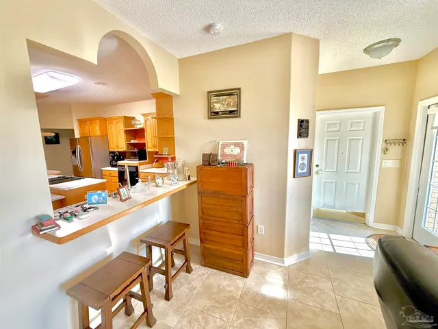 a spacious bathroom with a double vanity sink a mirror and a bathtub