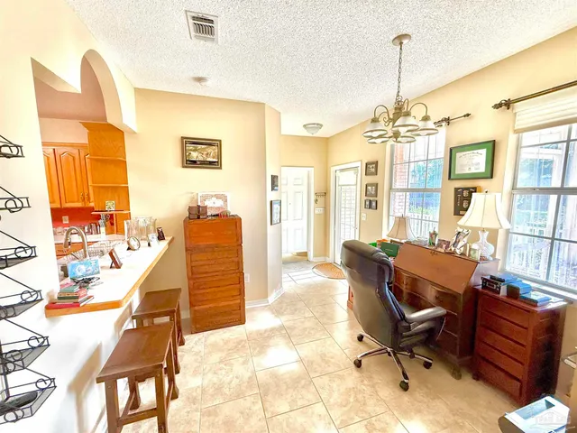 a bathroom with a bathtub and next to a window
