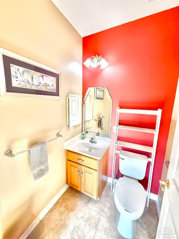 a bathroom with a glass door shower and toilet