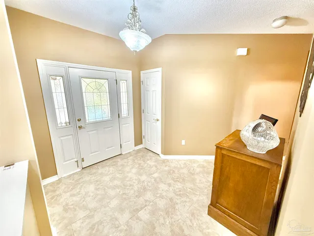 a room with furniture and a large window