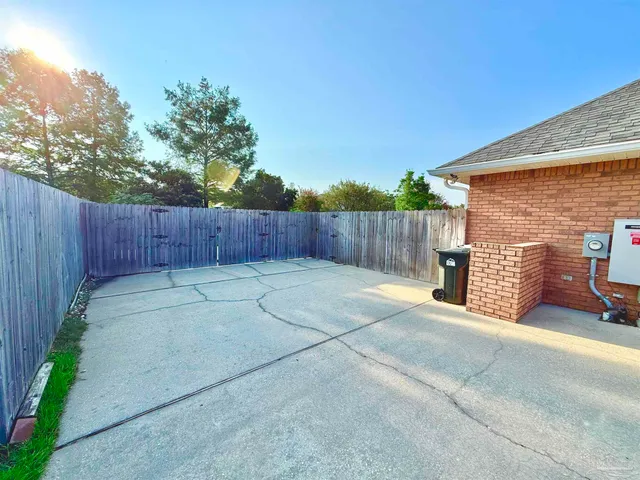 a view of a park with large trees