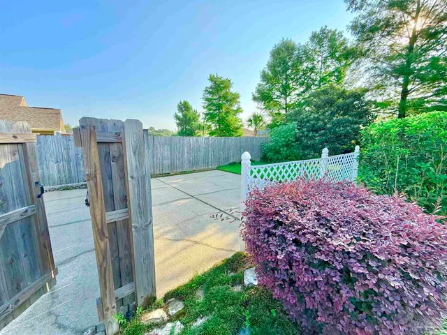 a view of a playground with basketball court