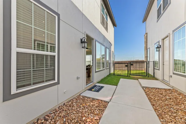 a view of a brick house with a large window
