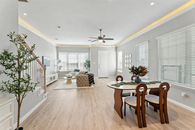 a view of a dining room with furniture and wooden floor
