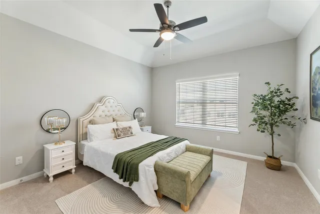 a bedroom with bed and a window