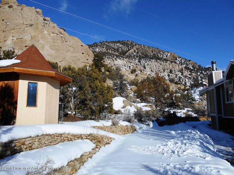 10874 Highway 13 Rifle, CO 81650 - Photo 3 of 15 a front view of a house with a yard