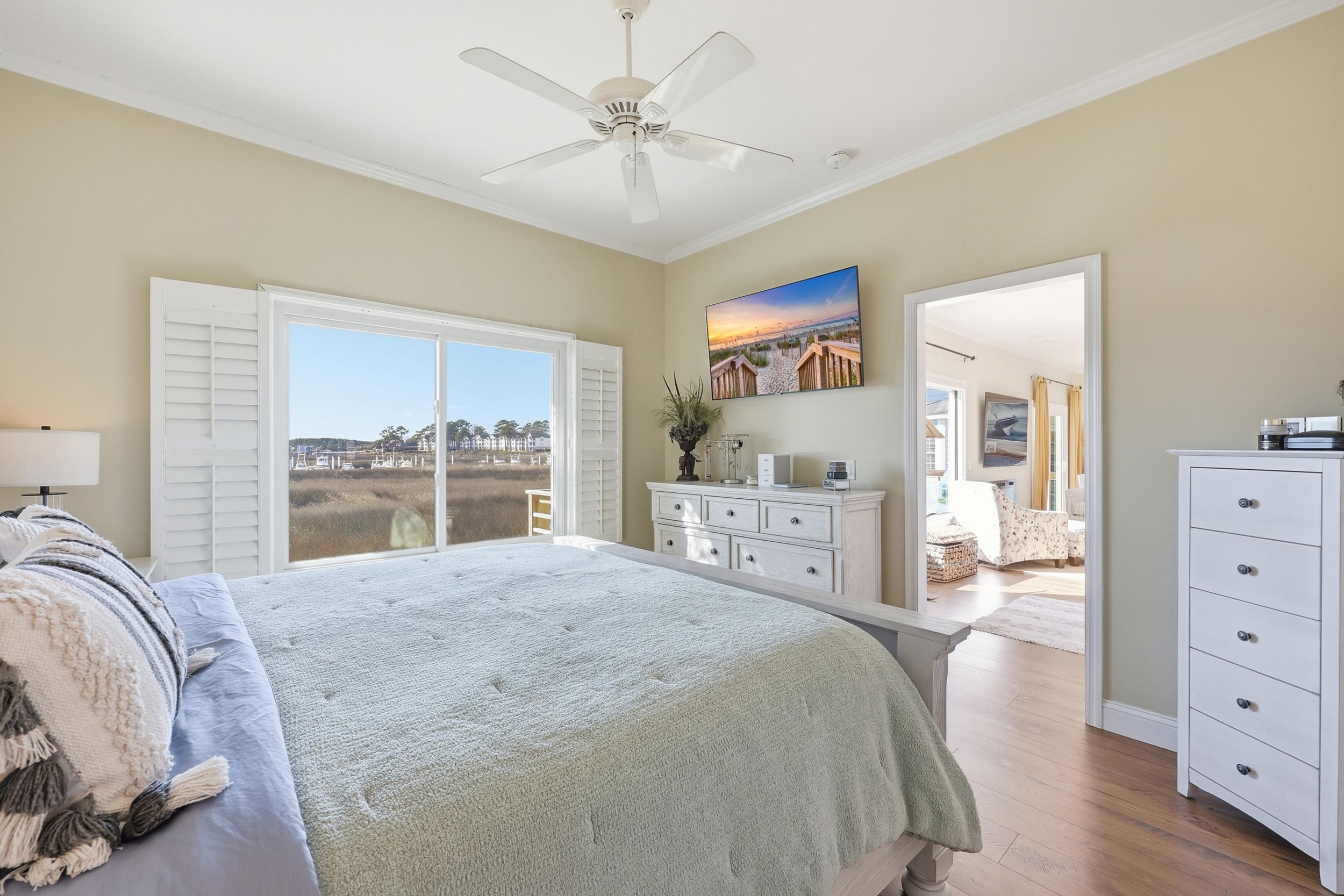4524 Landing Road Little River, SC 29566 - Photo 14 of 40 Bedroom with wood finished floors, ornamental molding, and ceiling fan