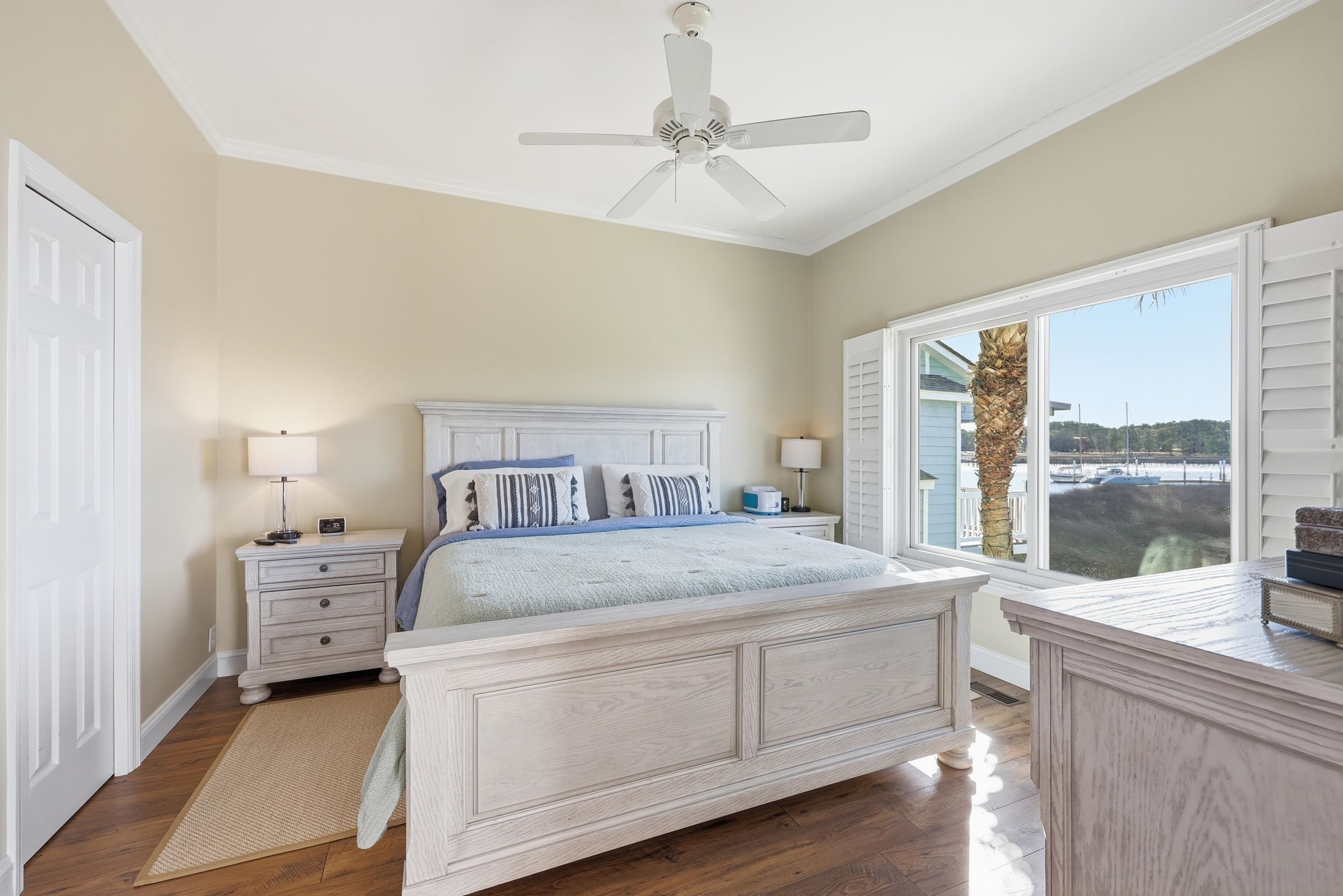 4524 Landing Road Little River, SC 29566 - Photo 15 of 40 Bedroom with ceiling fan, dark wood-style flooring, and crown molding