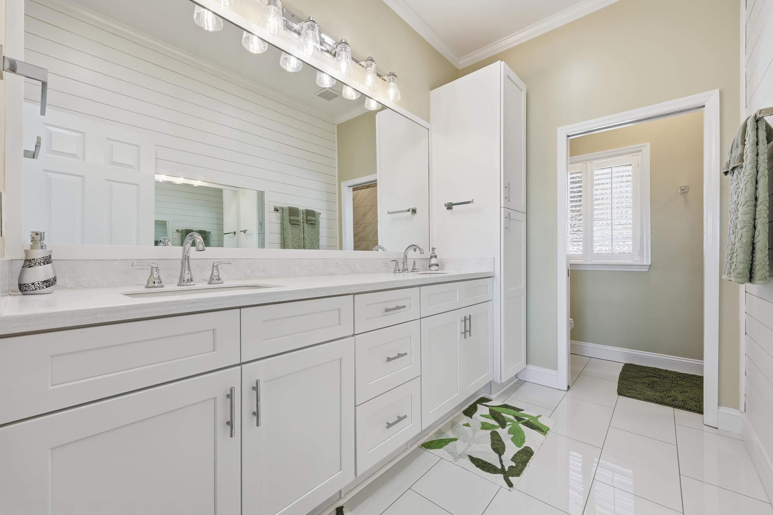 4524 Landing Road Little River, SC 29566 - Photo 16 of 40 Full bathroom featuring double vanity, light tile patterned floors, and ornamental molding