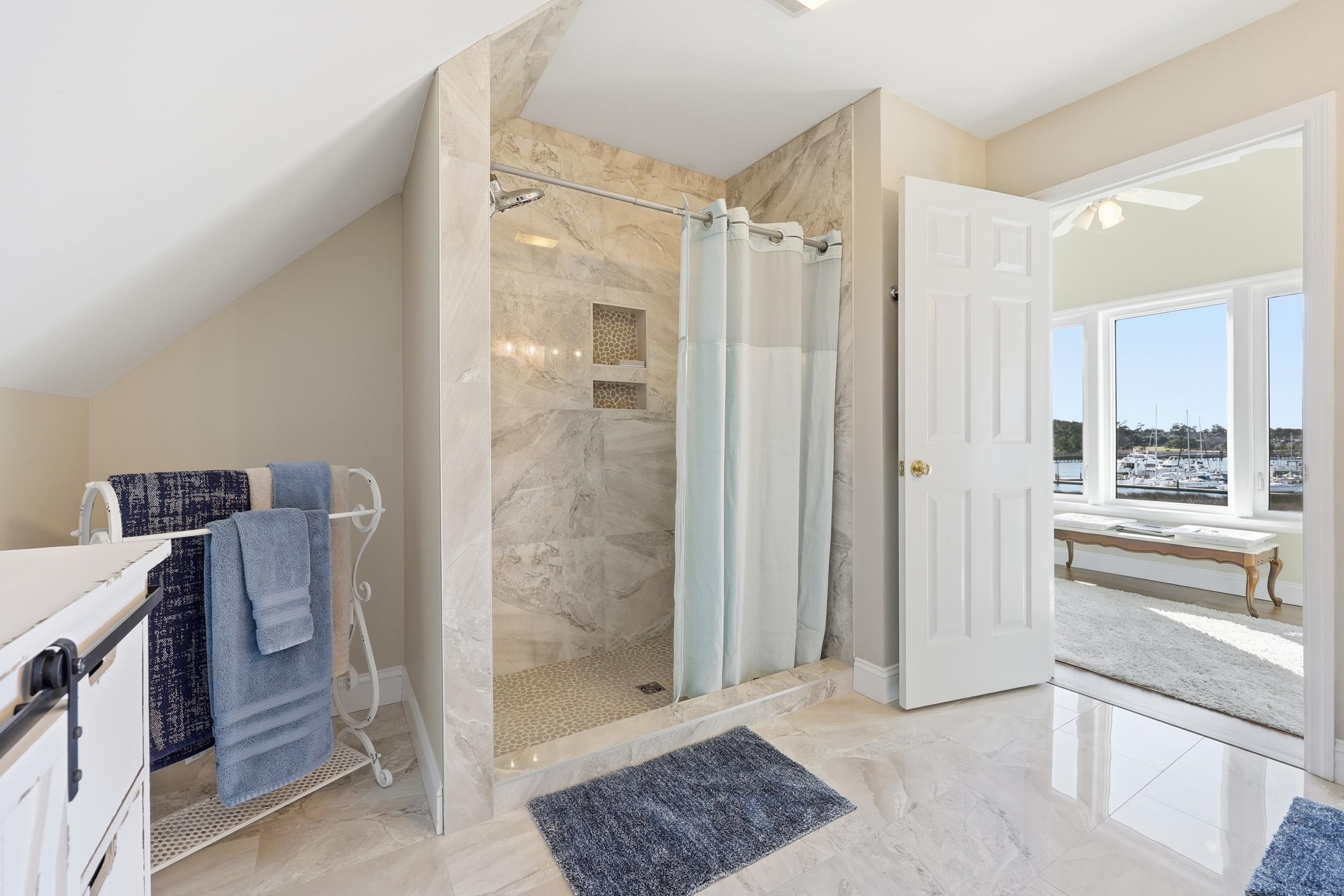 4524 Landing Road Little River, SC 29566 - Photo 23 of 40 Full bathroom featuring a marble finish shower, light marble finish floors, and vanity