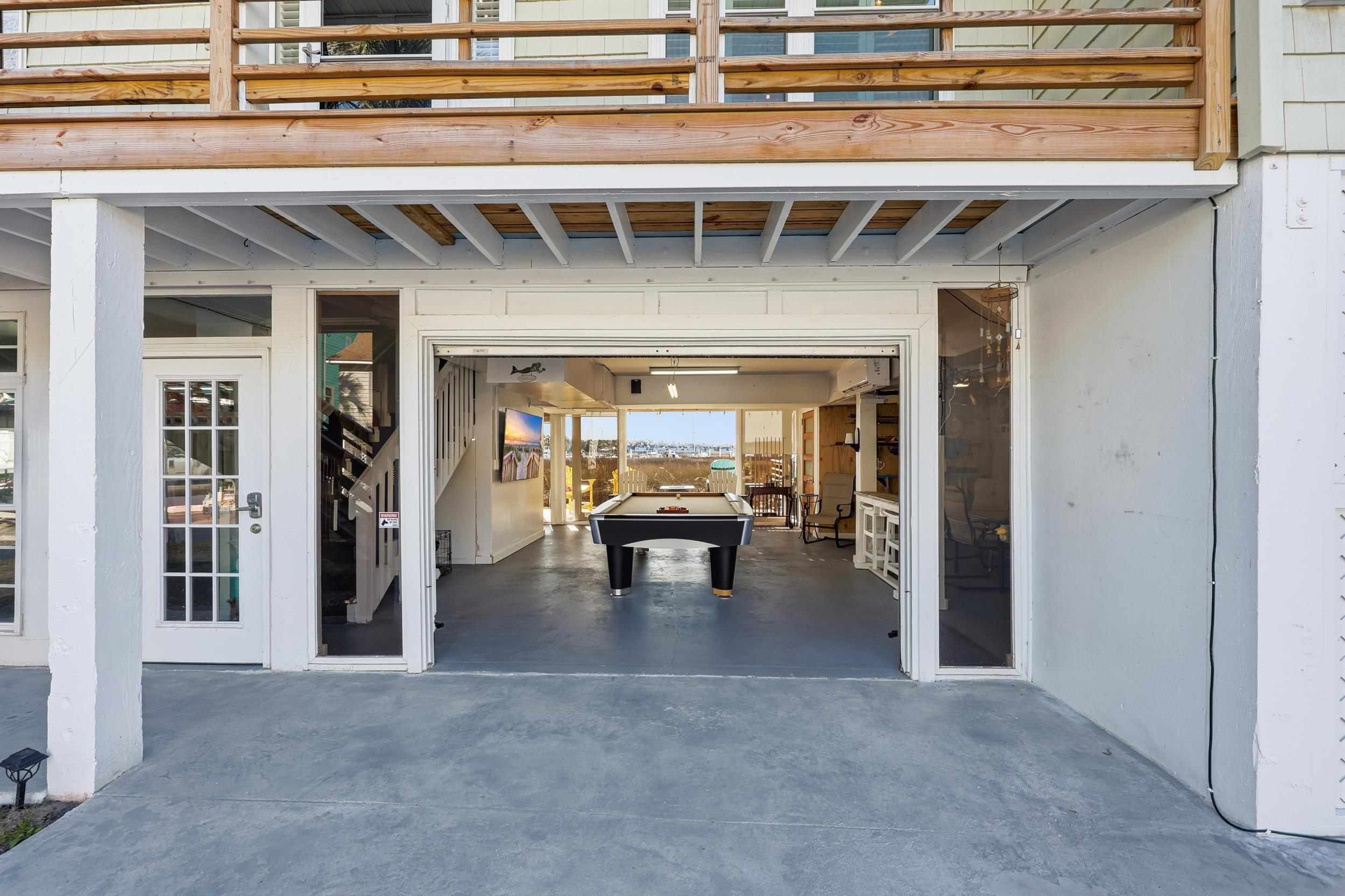4524 Landing Road Little River, SC 29566 - Photo 30 of 40 View of patio / terrace with a garage and concrete driveway