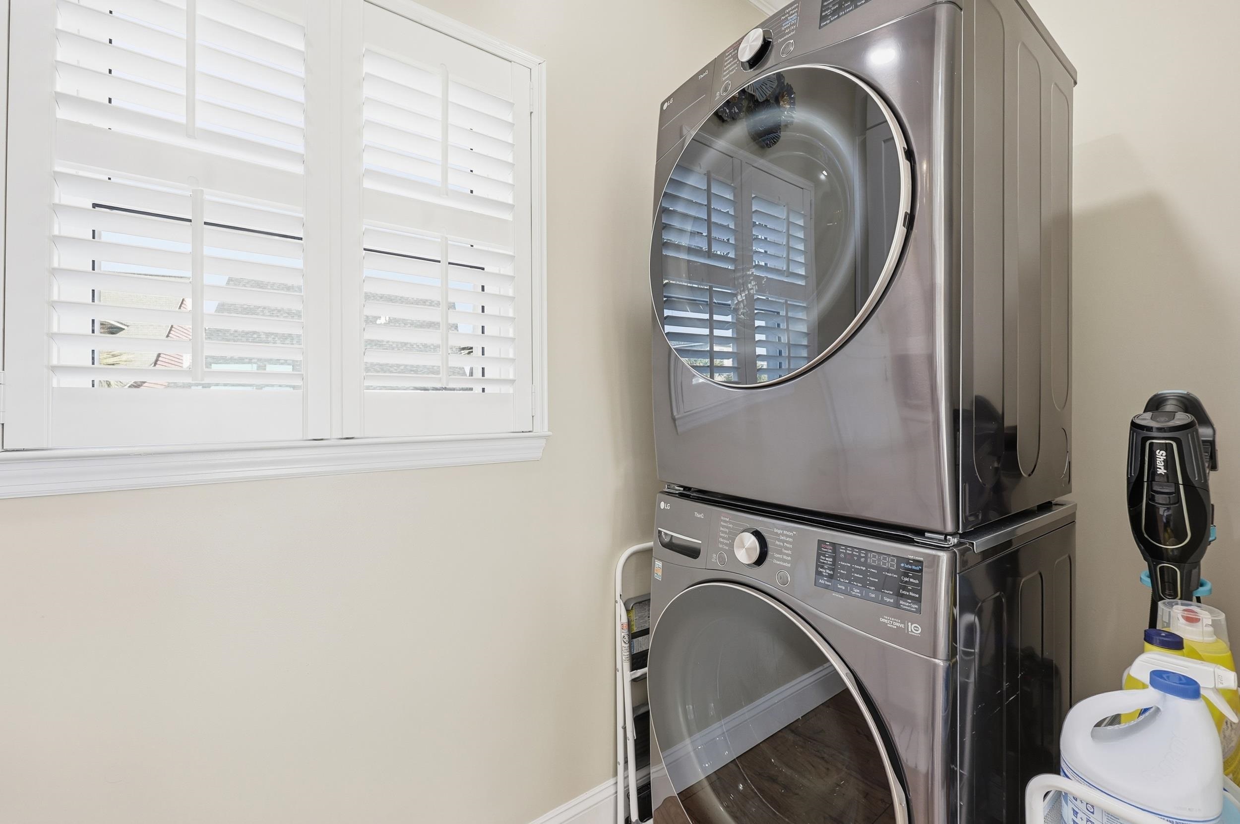 4524 Landing Road Little River, SC 29566 - Photo 10 of 40 Laundry room featuring stacked washer / dryer