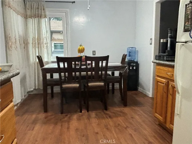 a view of a dining room with furniture and a table