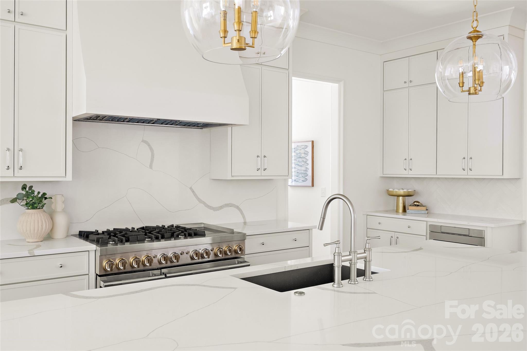 4628 Water Oak Road Charlotte, NC 28211 - Photo 13 of 43 a kitchen with a sink and cabinets