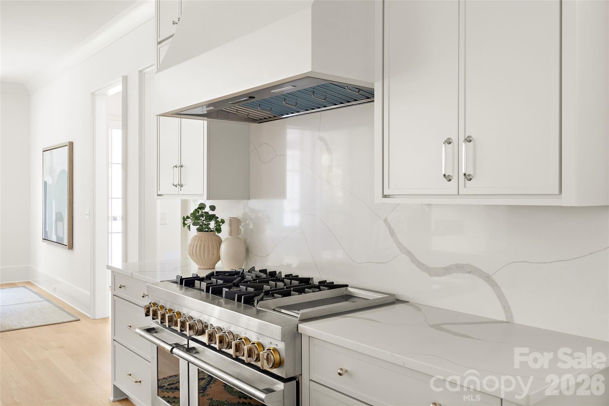 4628 Water Oak Road Charlotte, NC 28211 - Photo 14 of 43 a kitchen with white cabinets and appliances