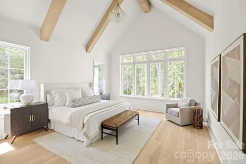 a bedroom with a bed and a couch