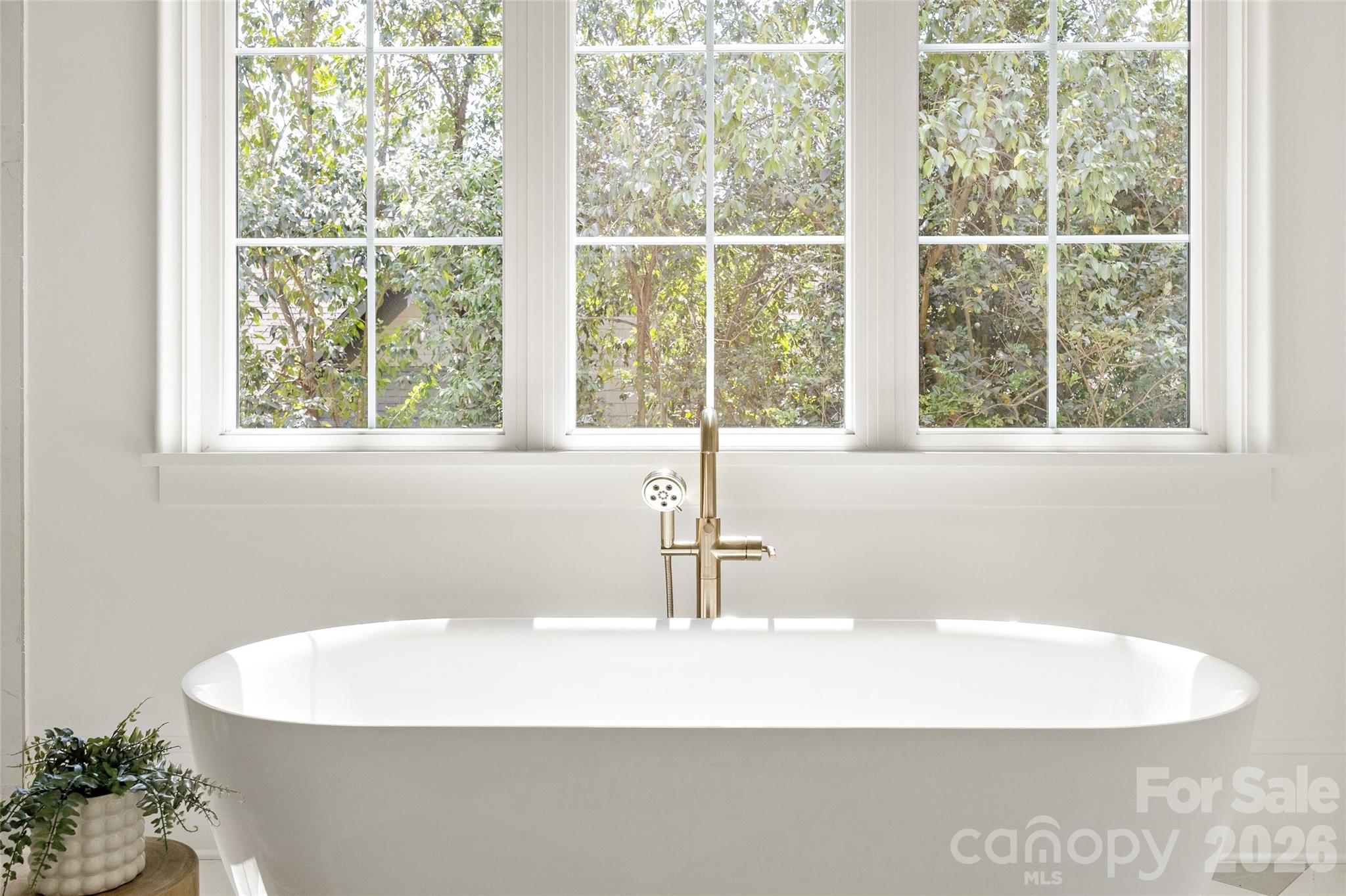 4628 Water Oak Road Charlotte, NC 28211 - Photo 22 of 43 a white bath tub sitting next to a window