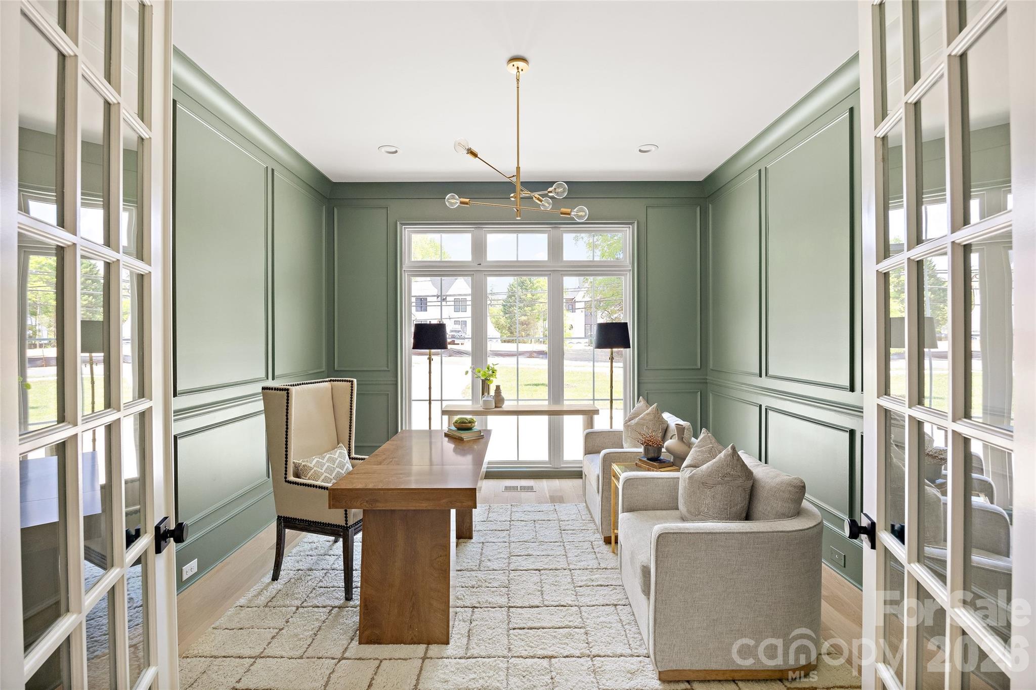 4628 Water Oak Road Charlotte, NC 28211 - Photo 24 of 43 a living room with fireplace furniture and a chandelier