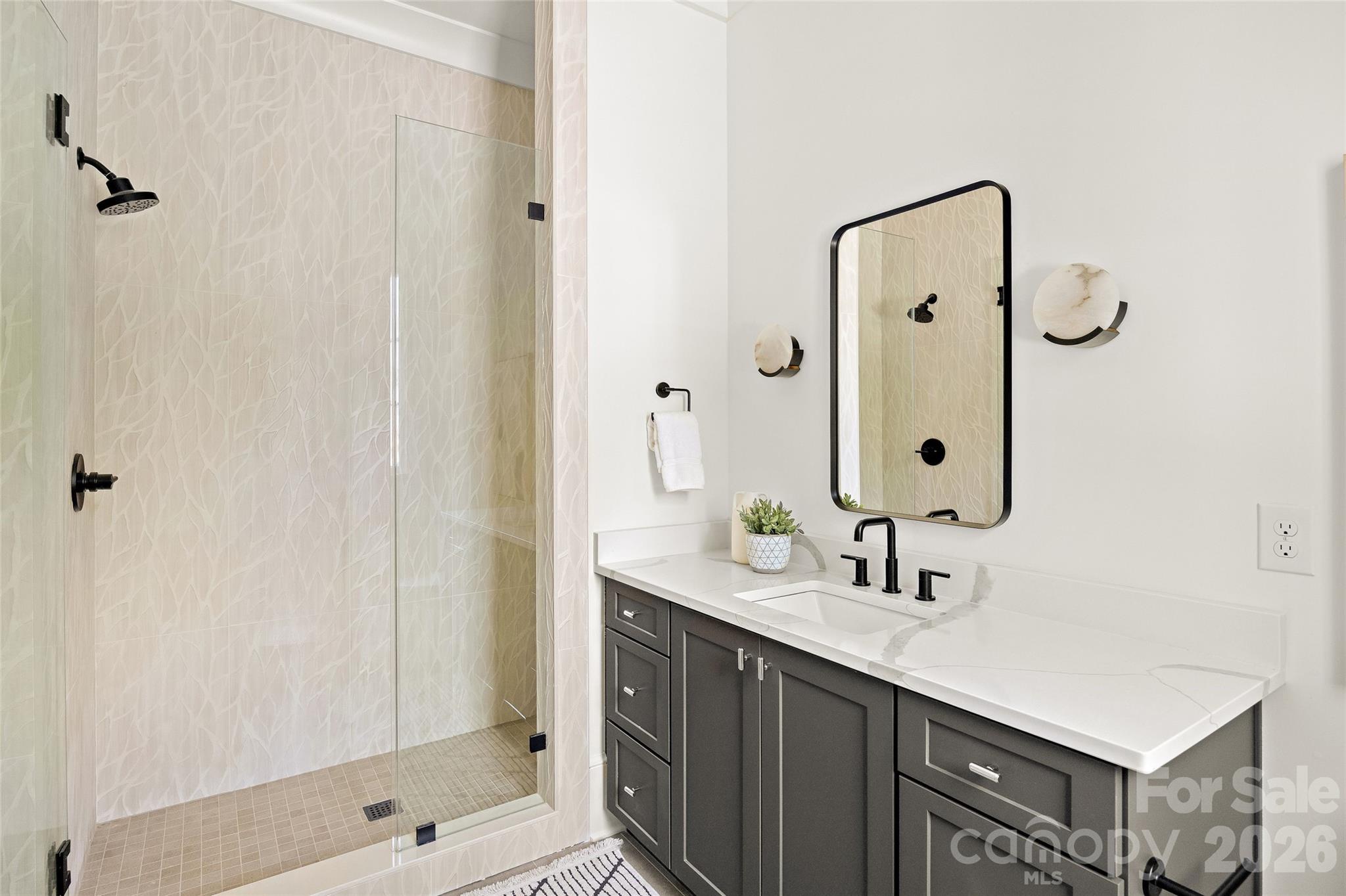 4628 Water Oak Road Charlotte, NC 28211 - Photo 26 of 43 a bathroom with a sink and a mirror