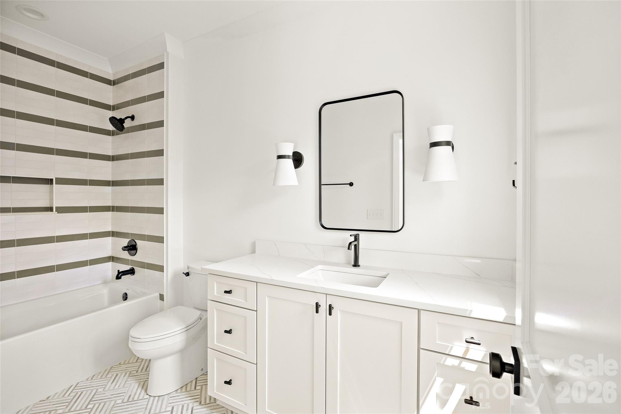 4628 Water Oak Road Charlotte, NC 28211 - Photo 32 of 43 a bathroom with a sink a toilet and shower