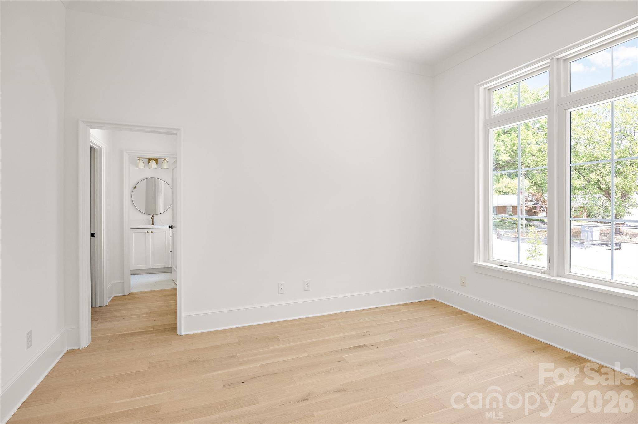 4628 Water Oak Road Charlotte, NC 28211 - Photo 34 of 43 an empty room with wooden floor and a window