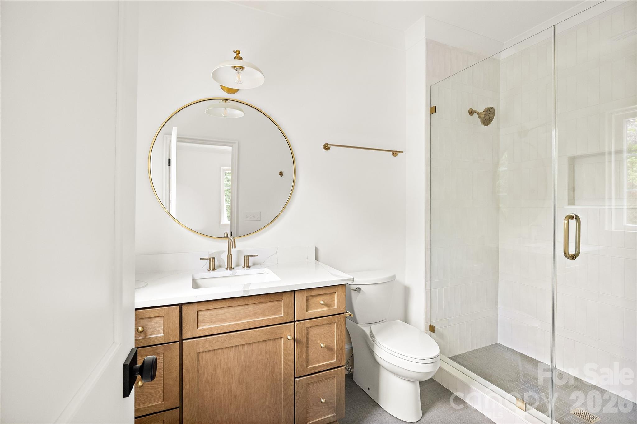 4628 Water Oak Road Charlotte, NC 28211 - Photo 37 of 43 a bathroom with a sink toilet and a mirror