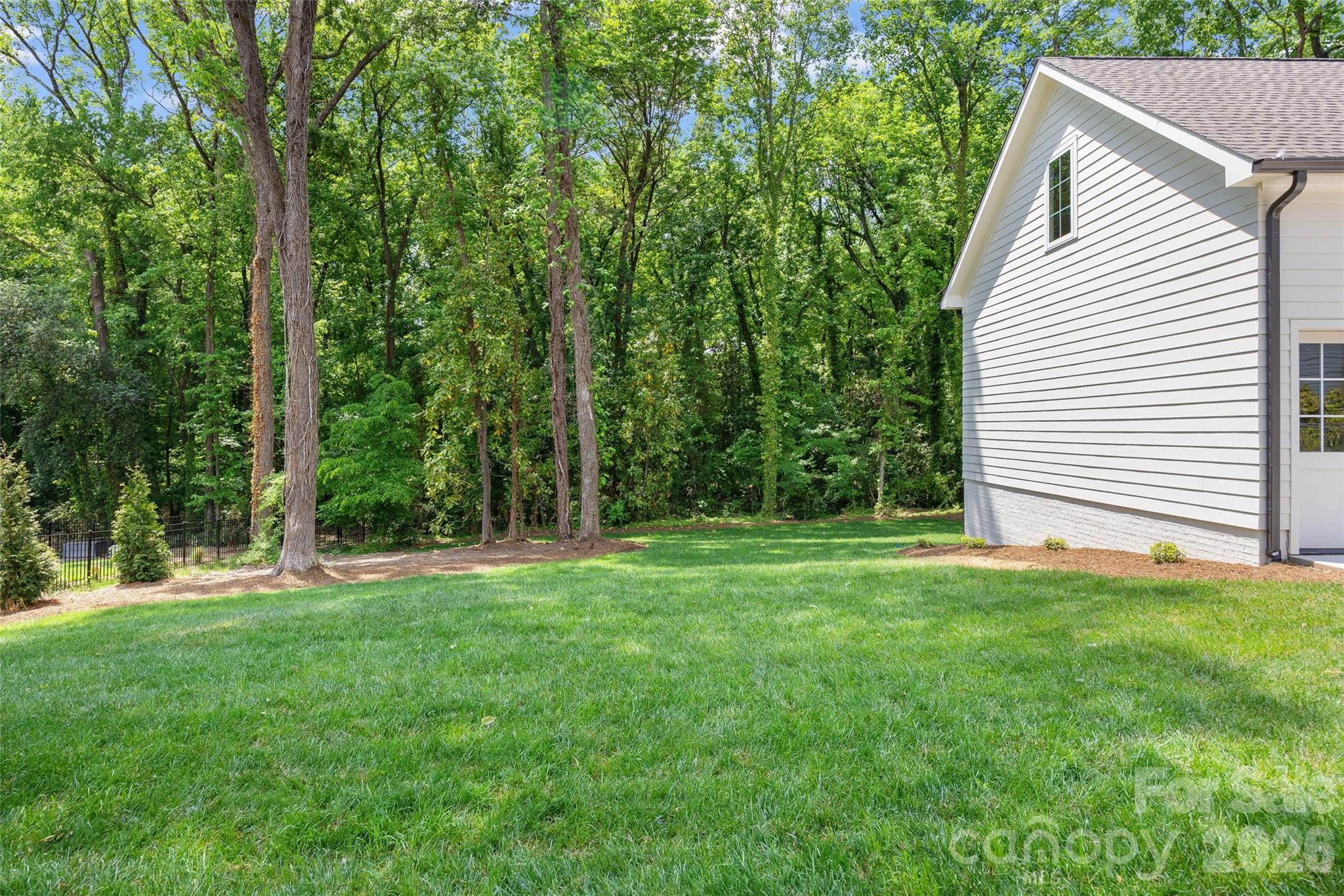 4628 Water Oak Road Charlotte, NC 28211 - Photo 41 of 43 a view of a backyard with a garden