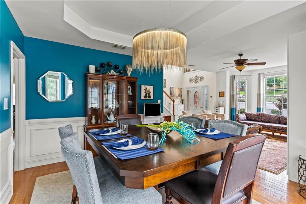 638 Glen Valley Way Dacula, GA 30019 - Photo 12 of 61 a view of a dining room with furniture and chandelier