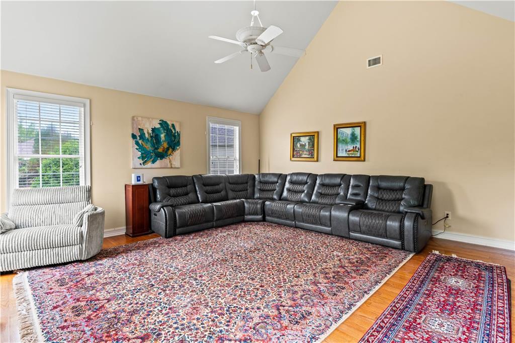 638 Glen Valley Way Dacula, GA 30019 - Photo 19 of 61 a living room with furniture and a couch