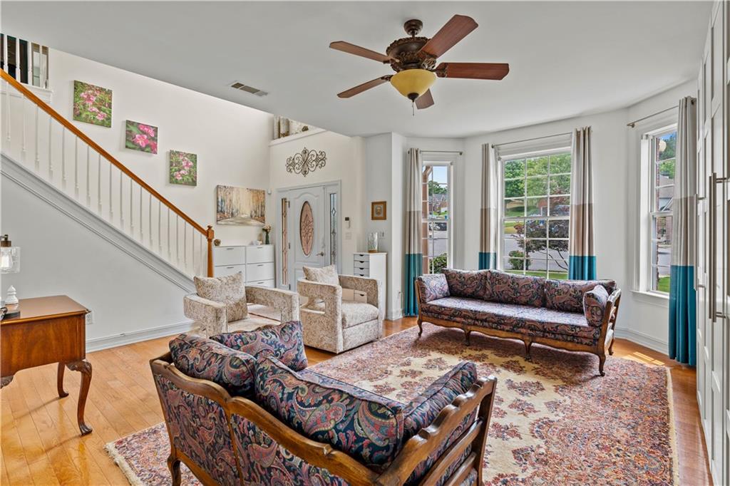 638 Glen Valley Way Dacula, GA 30019 - Photo 2 of 61 a living room with furniture and a large window