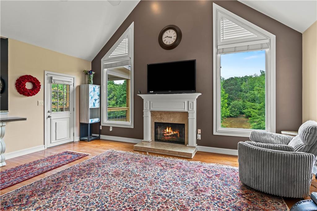 638 Glen Valley Way Dacula, GA 30019 - Photo 21 of 61 a living room with furniture a flat screen tv and a fireplace
