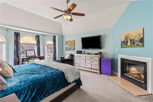 a spacious bathroom with a bathtub and a sink