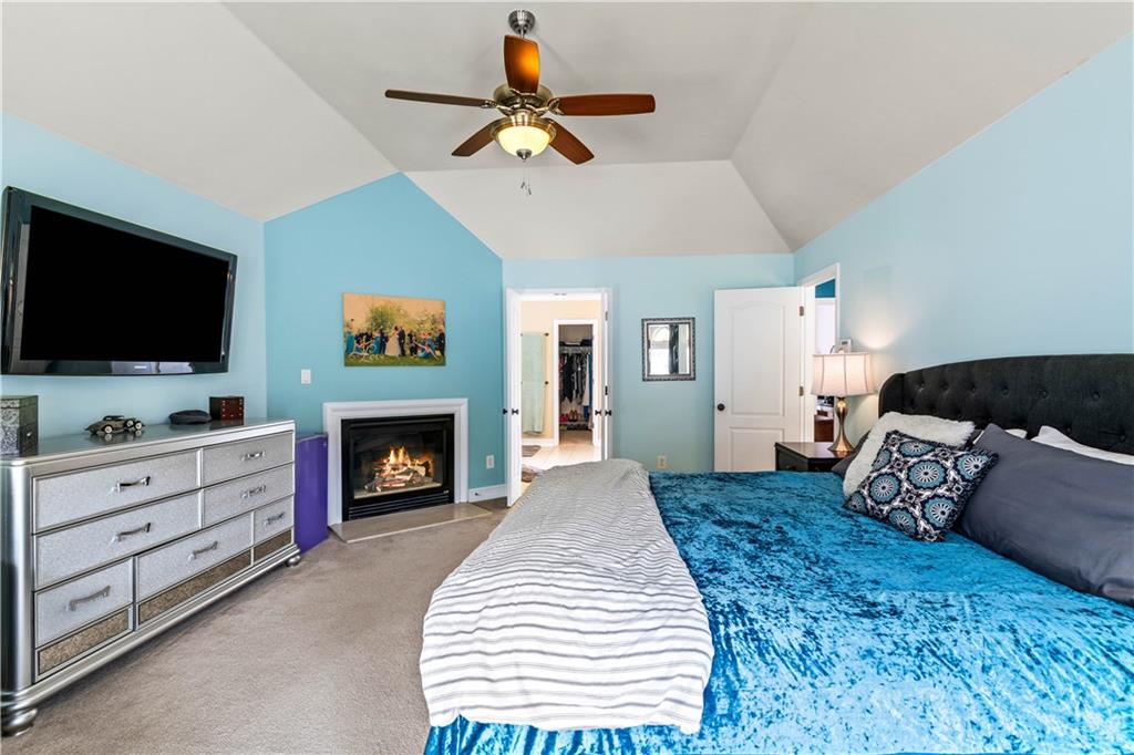 638 Glen Valley Way Dacula, GA 30019 - Photo 31 of 61 a living room with furniture fireplace and flat screen tv