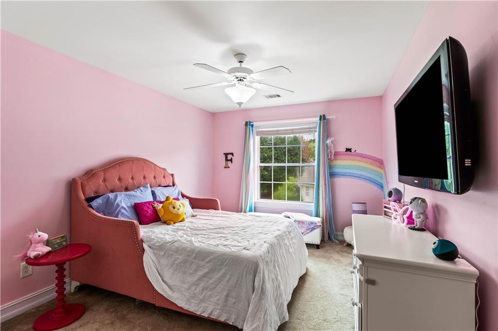 638 Glen Valley Way Dacula, GA 30019 - Photo 37 of 61 a bedroom with a bed and a window