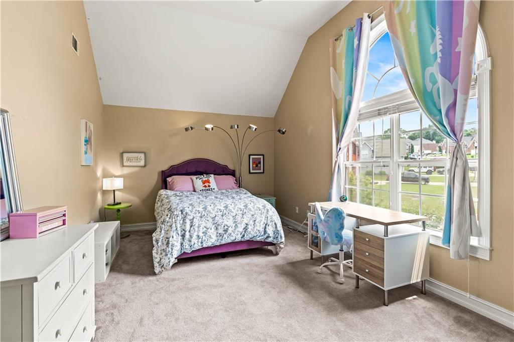 638 Glen Valley Way Dacula, GA 30019 - Photo 38 of 61 a bedroom with a bed and a window