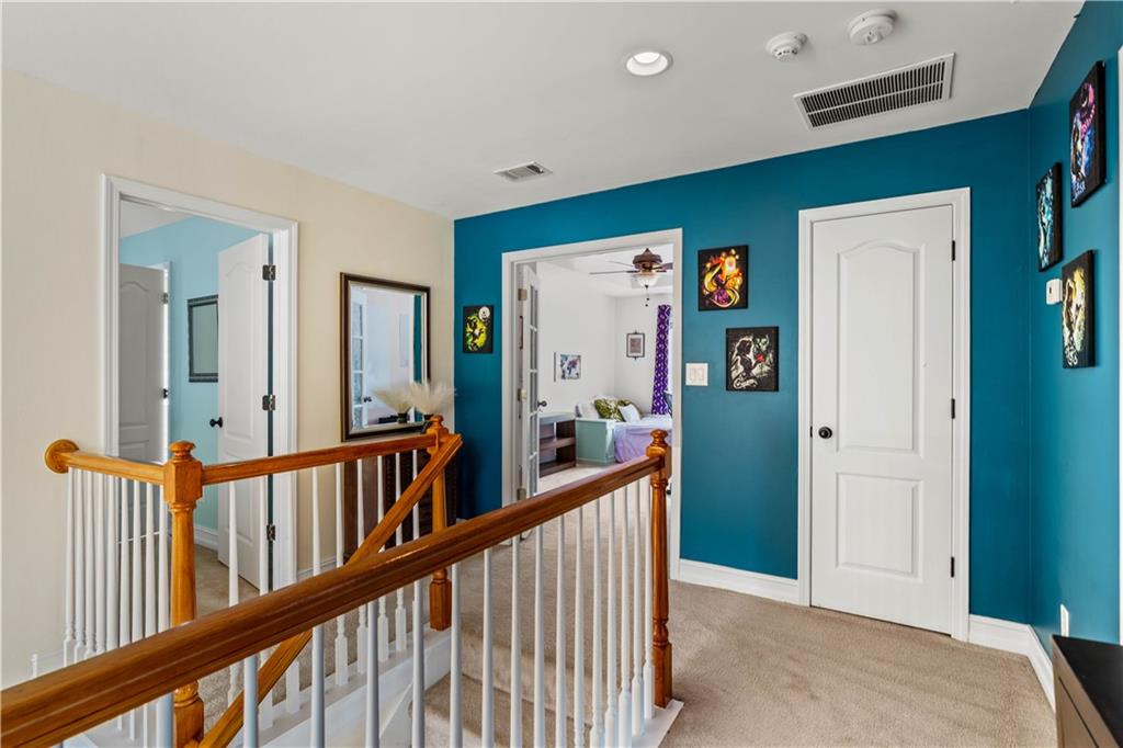 638 Glen Valley Way Dacula, GA 30019 - Photo 41 of 61 a view of a hallway with a livingroom and windows