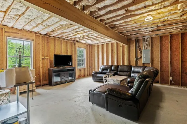 an aerial view of a house with a garden and a yard