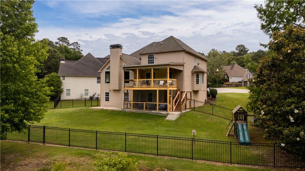 638 Glen Valley Way Dacula, GA 30019 - Photo 56 of 61 a view of a house with a big yard and large trees