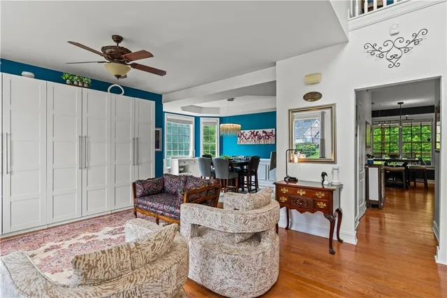 a living room with furniture and wooden floor